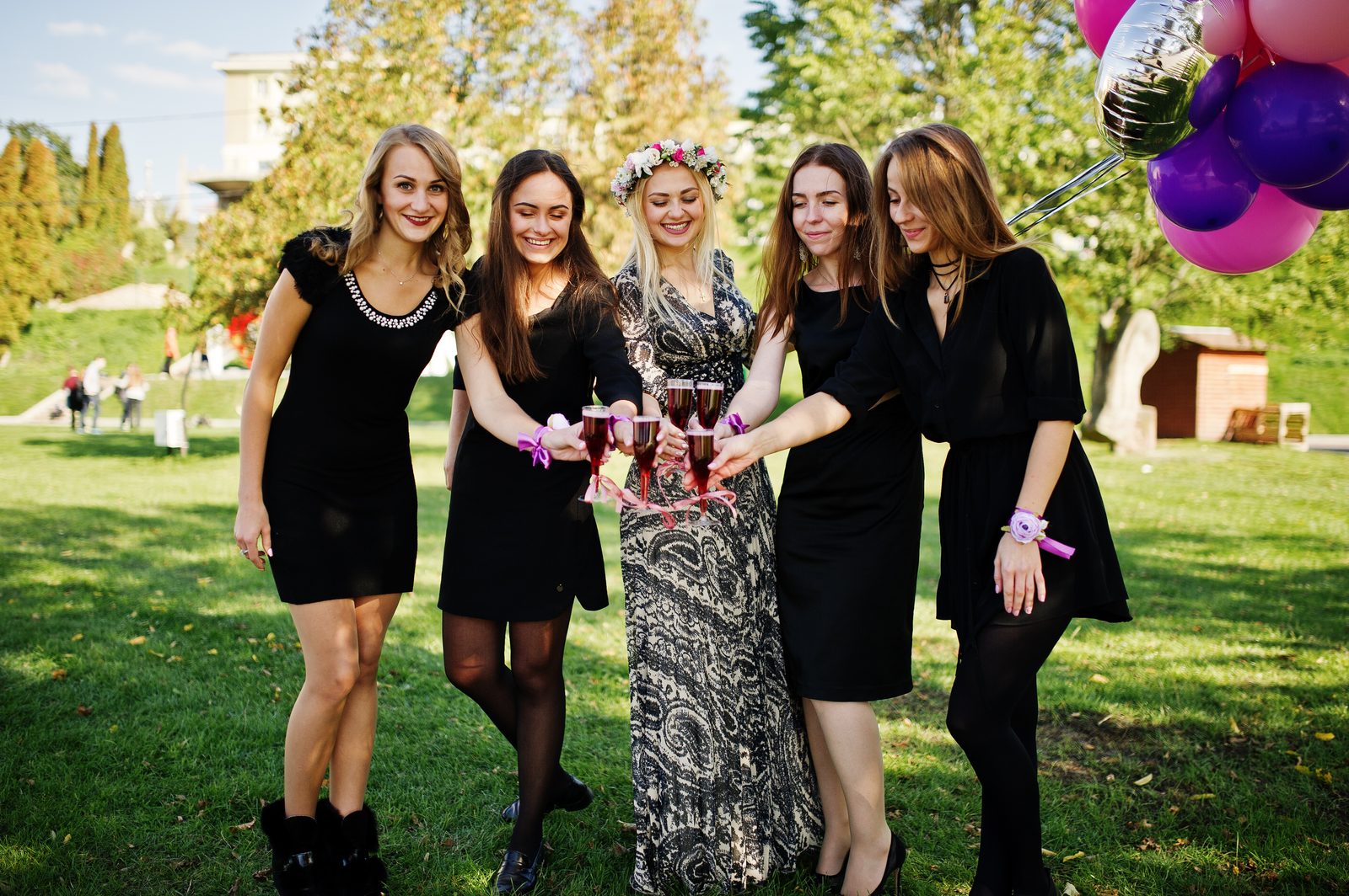 Friends celebrating outdoors at an event